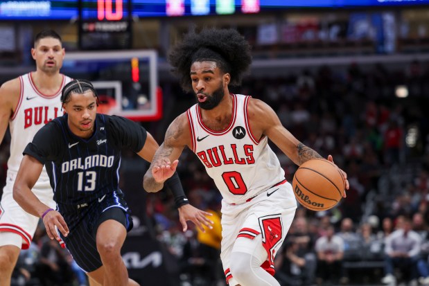 Bulls guard Coby White drives past Magic guard Jett Howard on Oct. 30, 2024, at the United Center. (Armando L. Sanchez/Chicago Tribune)