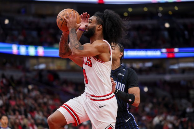 Chicago Bulls guard Coby White (0) drives past Orlando Magic guard Jett Howard (13) during the first quarter at the United Center Wednesday Oct. 30, 2024, in Chicago. (Armando L. Sanchez/Chicago Tribune)