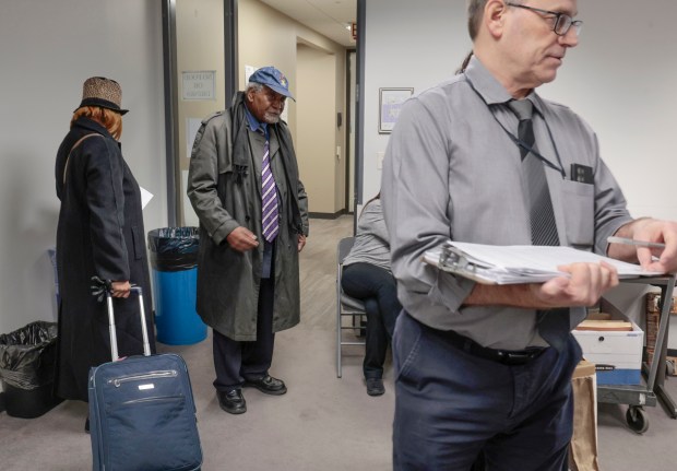 U.S. Rep. Danny Davis, center, appears Dec. 18, 2023 at the Cook County Office Building where he testified about an opponent's challenge that his campaign workers had forged his signature on campaign paperwork. (Antonio Perez/ Chicago Tribune)