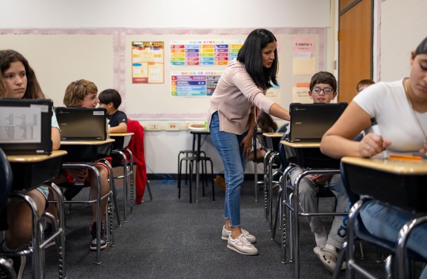 Teacher Abbie Shah helps students during a sixth grade math class, Oct. 29, 2024, at Lincoln Middle School in Park Ridge. (Brian Cassella/Chicago Tribune)