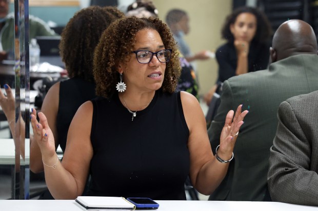 Michilla Blaise, who is campaigning to be on an elected school board, speaks at a public forum at Greater Rock Missionary Baptist Church in Chicago on Aug. 12, 2024. (Terrence Antonio James/Chicago Tribune)