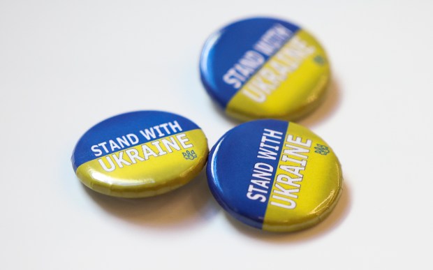 Stand with Ukraine buttons lie on a table during a non-partisan voter education forum regarding support for Ukraine at Milwaukee Public Library in Milwaukee on Oct. 20, 2024. (Eileen T. Meslar/Chicago Tribune)