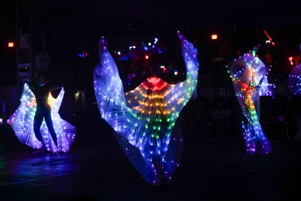 Lighted performers dance in the big top at UniverSoul Circus in Washington Park, Oct. 2, 2024, in Chicago. (Armando L. Sanchez/Chicago Tribune)