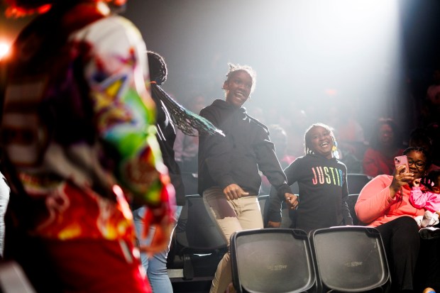 Children in the audience dance at UniverSoul Circus in Washington Park, Oct. 2, 2024. (Armando L. Sanchez/Chicago Tribune)