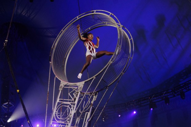 A performer runs in a spinning wheel at UniverSoul Circus in Washington Park, Oct. 2, 2024. (Armando L. Sanchez/Chicago Tribune)