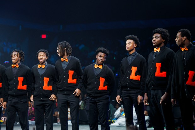 The Leo High School choir takes the stage before performing at UniverSoul Circus in Washington Park, Oct. 2, 2024. (Armando L. Sanchez/Chicago Tribune)