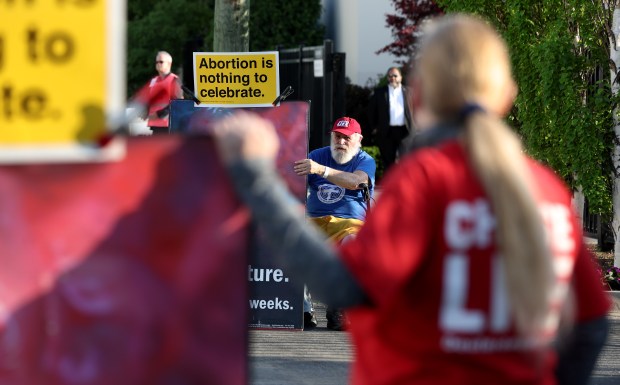 Pro-life activist Carl Lambrecht (cq) protests with others outside of a Planned Parenthood fundraiser at The Geraghty on Chicago's Southwest side on Wednesday, May 10, 2023. (Chris Sweda/Chicago Tribune)