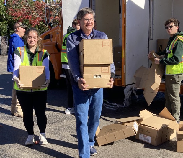 U.S. Rep. Brad Schneider, D-Highland Park, was among the people unloading a truck from the Northern Illinois Food Bank for the food distribution. (Steve Sadin/For the Lake County News-Sun)