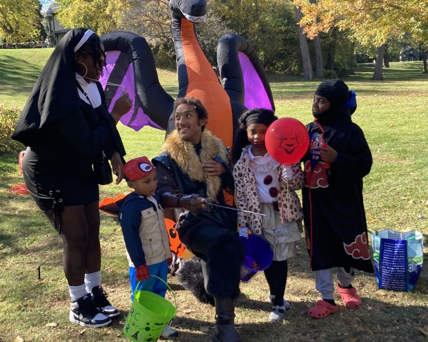 A nun and others take a break between trick-or-treat stations.  (Steve Sadin/For the Lake County News-Sun)