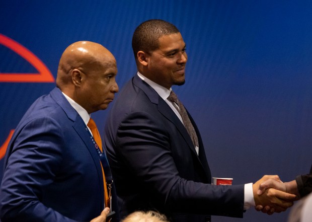 Bears President and CEO Kevin Warren, left, and general manager Ryan Poles greet people April 25, 2023, at Halas Hall. (Brian Cassella/Chicago Tribune)