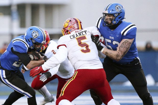 Lake Zurich's James Strojny, right, blocks Batavia's JP Chaney to clear space for teammate Chris Pirrone, left, during a Class 7A state semifinal in Lake Zurich on Saturday, Nov. 19, 2022.