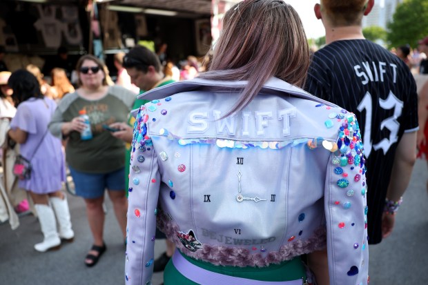 Taylor Swift fans check out merchandise outside Soldier Field in Chicago before the first night of Swift's Eras Tour on June 2, 2023. (Chris Sweda/Chicago Tribune)