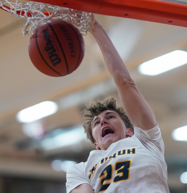 Neuqua Valley's Cole Kelly (23) dunks the ball off a fast break against West Aurora during a hoops for healing basketball tournament game at Oswego High School on Monday, Nov. 25, 2024. (Sean King / for The Beacon-News)