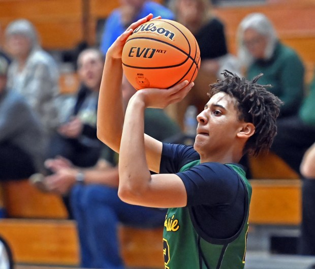 Waubonsie Valley's Kris Mporokoso shoots a three-pointer. Waubonsie Valley defeated Streamwood 84-29 in the Ken Peddy 2024 Windmill City Classic boys tournament, Tuesday, Nov. 26, 2024, in Batavia, Illinois. (Jon Langham/for the Beacon-News)