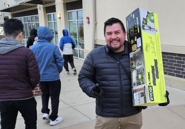 Jose Gonzalez of Naperville was part of the big crowd of shoppers out at Chicago Premium Outlets in Aurora Friday morning. (David Sharos / For The Beacon-News)