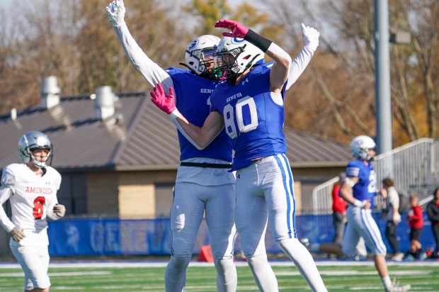 Geneva's Bennett Konkey (80) celebrates with Talyn Taylor (right) after scoring a touchdown against Amundsen during a class 6A first-round playoff football game in Geneva on Saturday, Nov 2, 2024. (Sean King / for The Beacon-News)