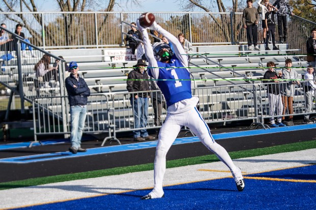 Geneva's Talyn Taylor (1) catches a pass for a touchdown against Amundsen during a class 6A first-round playoff football game at in Geneva on Saturday, Nov 2, 2024. (Sean King / for The Beacon-News)