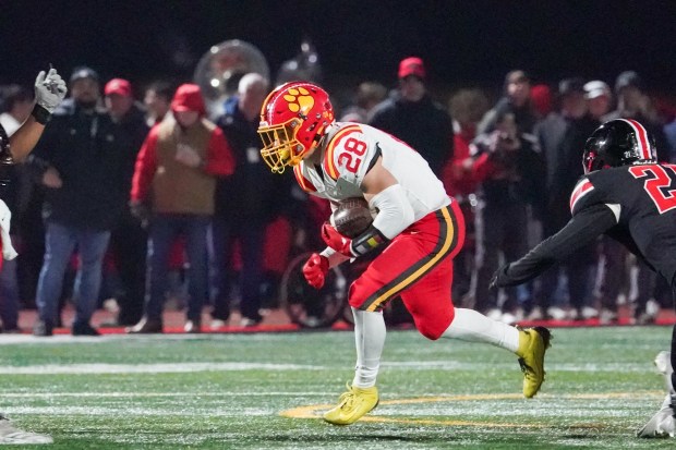 Batavia's Nathan Whitwell (28) carries the ball against Lincoln-Way Central during a Class 7A state semifinal football game at Lincoln-Way Central High School on Saturday, Nov 23, 2024. (Sean King / for The Beacon-News)