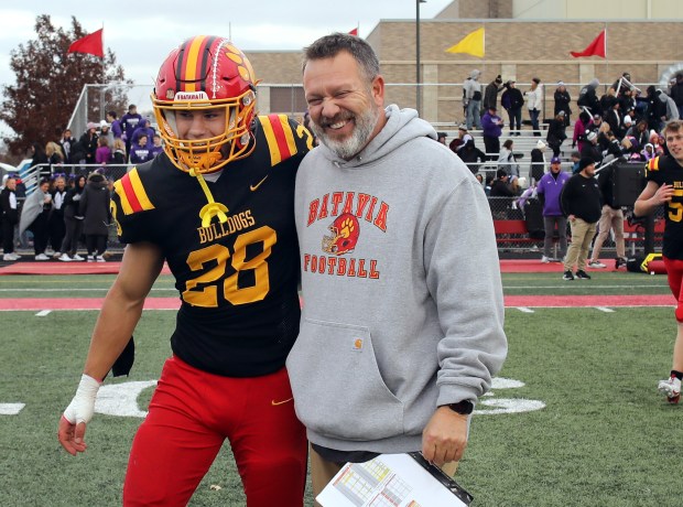 Batavia's Nathan Whitwell and Dennis Piron are all smiles after winning the Class 7A state quarterfinal football game against Downers Grove North in Batavia on Sat, Nov. 16, 2024. (James C. Svehla / for the Beacon-News)