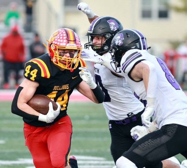 Batavia's Jake Feller gains yards against Downers Grove North during the Class 7A state quarterfinal football game in Batavia on Sat, Nov. 16, 2024. (James C. Svehla / for the Beacon-News)