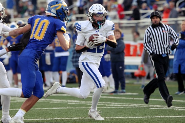 Geneva's Dominic Dileonardi (22), looking for the end zone, during the Class 6A state quarterfinal, on Saturday, Nov. 16, 2024, in Lake Forest. (Mark Ukena/for the Pioneer Press)