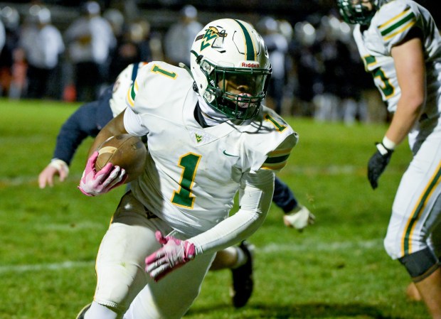 Waubonsie Valley's Chrisjan Simmons (1) runs the ball against Oswego during a Class 8A first-round game in Oswego on Friday, Nov. 1, 2024. (Mark Black / for the Beacon-News)