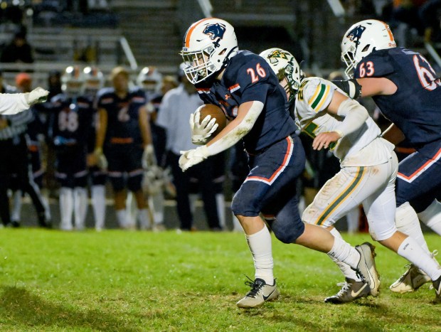 Oswego's Dekker Zelensek (26) runs the ball up the middle for a third quarter touchdown against Waubonsie Valley during a Class 8A first-round game in Oswego on Friday, Nov. 1, 2024. (Mark Black / for the Beacon-News)