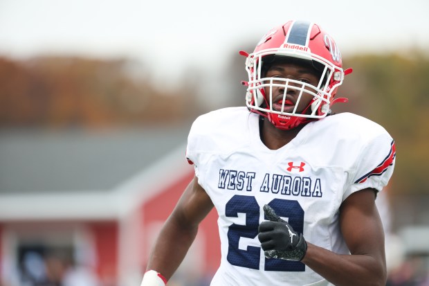 West Aurora defensive back Azuriah Sylvester (22) runs off the field during a Class 8A second-round game at Maine South High School in Park Ridge on Saturday, Nov. 9, 2024. (Talia Sprague / Beacon News)