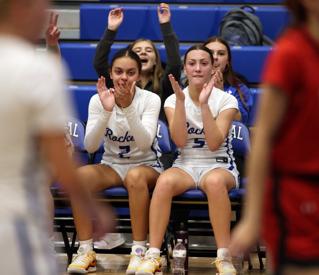 Burlington Central's Jordyn Charles (2) and Audrey LaFleur (5) react to a basket against East Aurora during a Einwich Tournament game Tuesday, Nov. 19, 2024 in Burlington. (H. Rick Bamman / The Beacon-News)