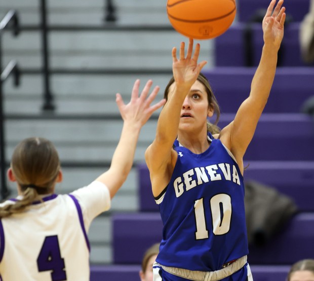 Geneva's Peri Sweeney (10) launches a three point basket over Hampshire's Peyton McCarthy (4) in the third quarter during a Doreen Zierer Tournament game in Hampshire on Friday, Nov. 22, 2024.(H. Rick Bamman/for the Beacon-News)