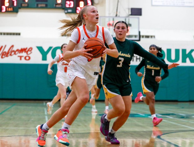 St. Charles East's Brooklyn Schilb (5) starts for a layup against Waubonsie Valley during the York Thanksgiving Tournament at York Community High School in Elmhurst, IL, on Monday, Nov. 18, 2024. (Nate Swanson / for the Beacon-News)