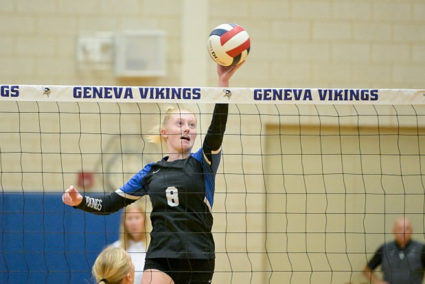 Geneva's Lillian Hallahan (8) taps the ball over the net against Metea Valley during the Class 4A Geneva Regional final in Geneva on Thursday, Oct. 31, 2024. (Mark Black / for the Beacon-News)