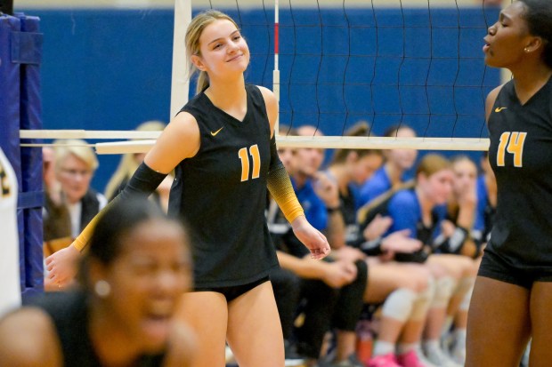 Metea Valley's Maddie Hopkins (11) celebrates a point against Geneva during the Class 4A Geneva Regional final in Geneva on Thursday, Oct. 31, 2024. (Mark Black / for the Beacon-News)