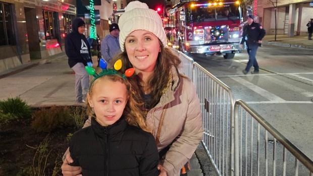 Carrie McQueary and her daughter Kendall, 9, of North Aurora came to enjoy the Winter Lights Fest in Aurora Friday night. (David Sharos / For The Beacon-News)