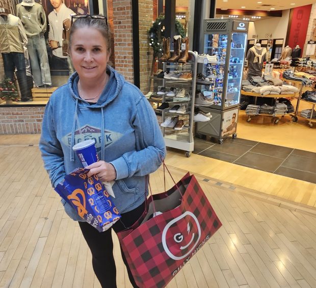 Melissa Ward of Naperville shops at Fox Valley Mall in Aurora recently. She said her holiday shopping actually began in Oct.. (David Sharos / For The Beacon-News)