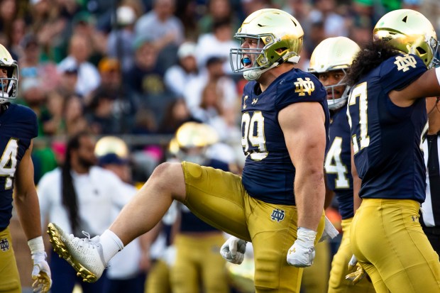 Notre Dame defensive lineman Rylie Mills (99) celebrates during the second half of an NCAA college football game against Stanford, Saturday, Oct. 12, 2024, in South Bend, Ind. (AP Photo/Michael Caterina)