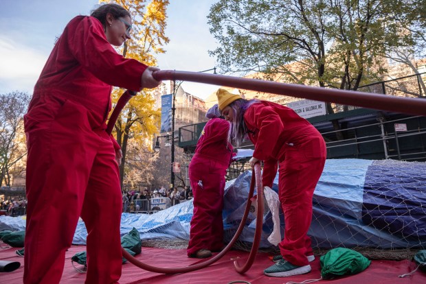 People inflate floats in preparation for the Macy's Thanksgiving Day Parade, Wednesday, Nov. 27, 2024, in New York. (AP Photo/Yuki Iwamura)