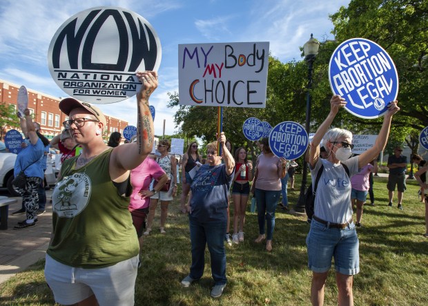 Abortion rights protesters hold signs outside the Porter County Courthouse in Valparaiso, Indiana Friday June 24, 2022. Earlier in the day the Supreme Court announced the overturning of Roe v Wade. (Andy Lavalley for the Post-Tribune)