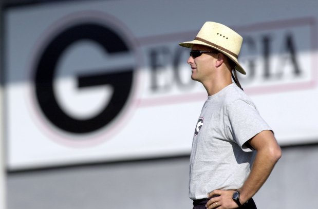 ** ADVANCE FOR WEEKEND AUG. 10-11 ** Georgia coach Mark Richt watches his team practice in Athens, Ga., Thursday, Aug. 8, 2002. Richt and his young staff survived their rookie season, returning intact and are feeling a bit more comfortable in their roles. (AP Photo/John Bazemore) ORG XMIT: AXB102