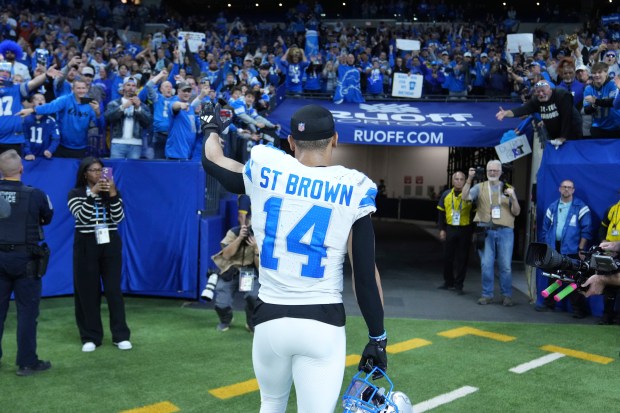 Lions wide receiver Amon-Ra St. Brown walks off the field after a a win on Nov. 24, 2024, in Indianapolis. (AP Photo/Michael Conroy)