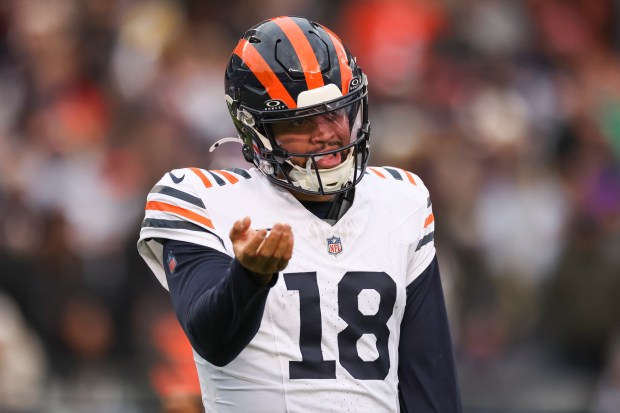 Bears quarterback Caleb Williams reacts after getting a delay of game penalty in overtime at Soldier Field on Nov. 24, 2024. (Eileen T. Meslar/Chicago Tribune)