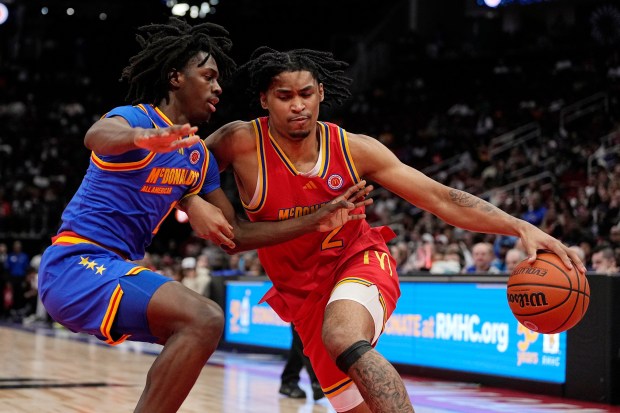 Dylan Harper drives on Ian Jacksonduring the first quarter of the McDonald's All American boys' game on Tuesday, April 2, 2024, in Houston. (AP Photo/Kevin M. Cox)