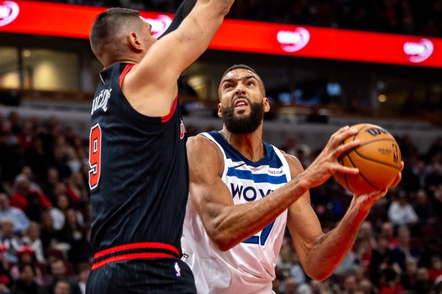 Chicago Bulls center Nikola Vucevic (9) defends Minnesota Timberwolves center Rudy Gobert (27) during the first quarter at the United Center on Nov. 7, 2024. (Tess Crowley/Chicago Tribune)