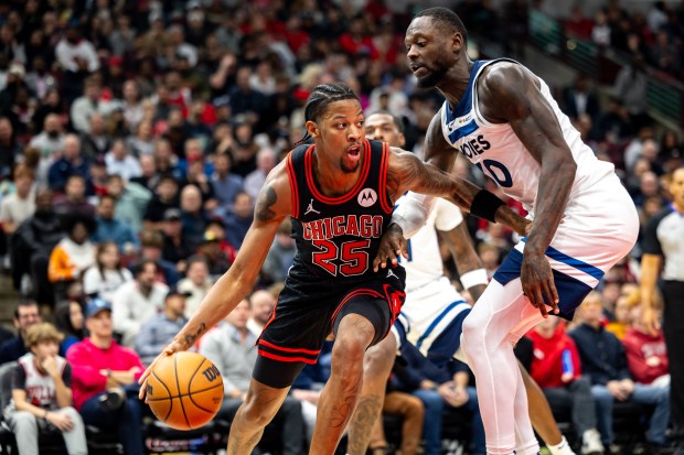 Minnesota Timberwolves forward Julius Randle (30) defends Chicago Bulls guard Dalen Terry (25) during the third quarter at the United Center on Nov. 7, 2024. (Tess Crowley/Chicago Tribune)