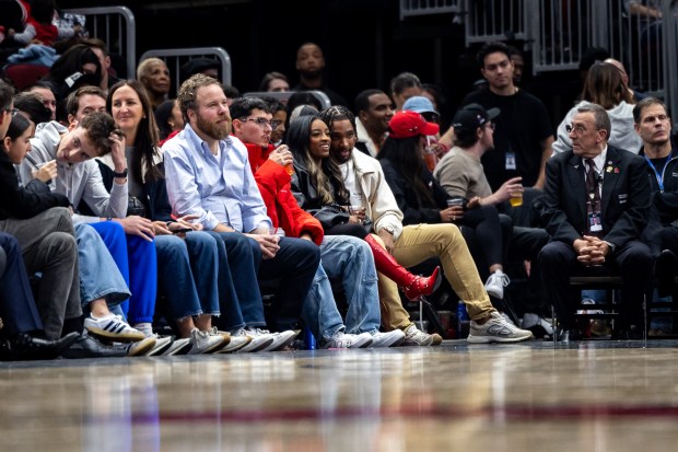 Simone Biles and husband Jonathan Owens, seated at the end of the row, watch the Chicago Bulls play against the Minnesota Timberwolves at the United Center on Nov. 7, 2024. (Tess Crowley/Chicago Tribune)