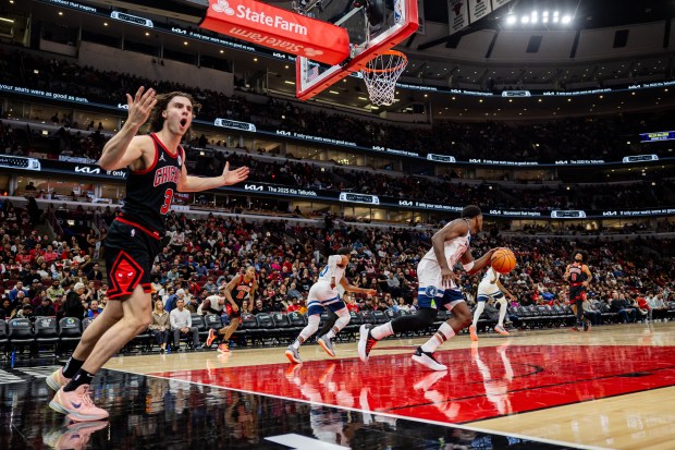 Chicago Bulls guard Josh Giddey (3) yells after missing a basket and Minnesota Timberwolves guard Anthony Edwards (5) gets the rebound during the third quarter at the United Center on Nov. 7, 2024. (Tess Crowley/Chicago Tribune)