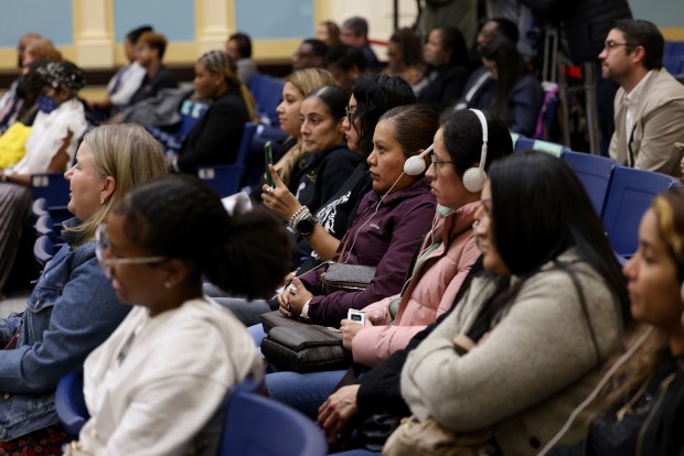 Attendees and public speakers listen to board members speak during the Chicago Board of Education's monthly agenda review meeting at the CPS Coleman Regional Offices and Training Offices in Chicago, Thursday, Oct. 24, 2024. (Antonio Perez/Chicago Tribune)