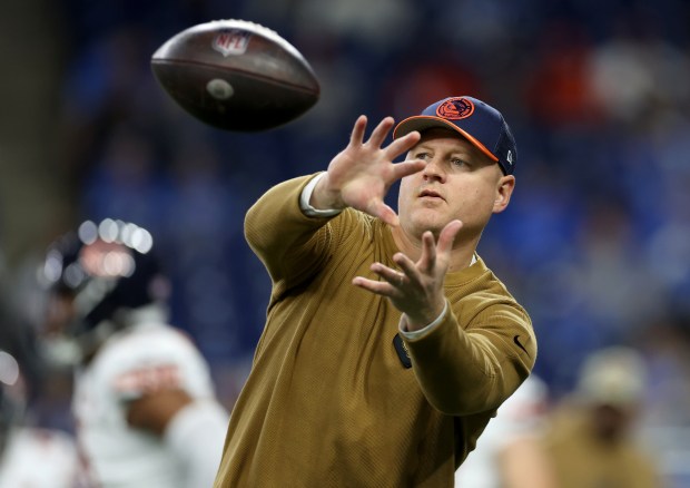 Bears offensive coordinator Luke Getsy catches a ball during warmups for a game against the Lions on Nov. 19, 2023, at Ford Field in Detroit. (Chris Sweda/Chicago Tribune)