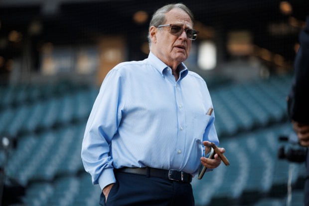 Chairman Jerry Reinsdorf smokes a cigar during warm ups before the White Sox play the New York Yankees at Guaranteed Rate Field Monday, Aug. 7, 2023 in Chicago. (Armando L. Sanchez/Chicago Tribune)