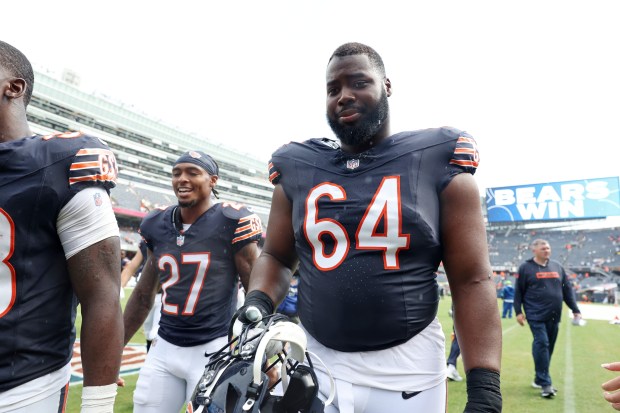 Bears guard Nate Davis (64) heads off the field after a 27-3 win over the Bears in a preseason game at Soldier Field on Aug. 17, 2024, in Chicago. (John J. Kim/Chicago Tribune)